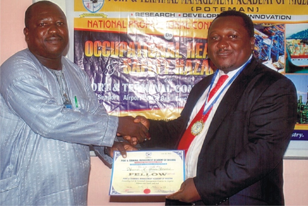 R-L: The General Manager, Nigerian Chamber of Shipping, Mr. Nnamdi Eronini receiving the certificate and other insignia for conferment of the Fellowship of the Port & Terminal Management Academy of Nigeria (POTEMAN) by the Registrar, Dr. Samuel Babatunde